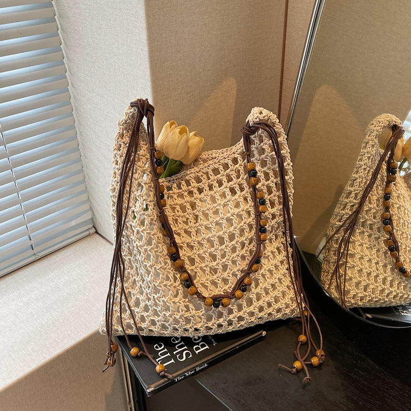 Yan Jin Cheng woven straw shoulder bag with beaded fringe front view
