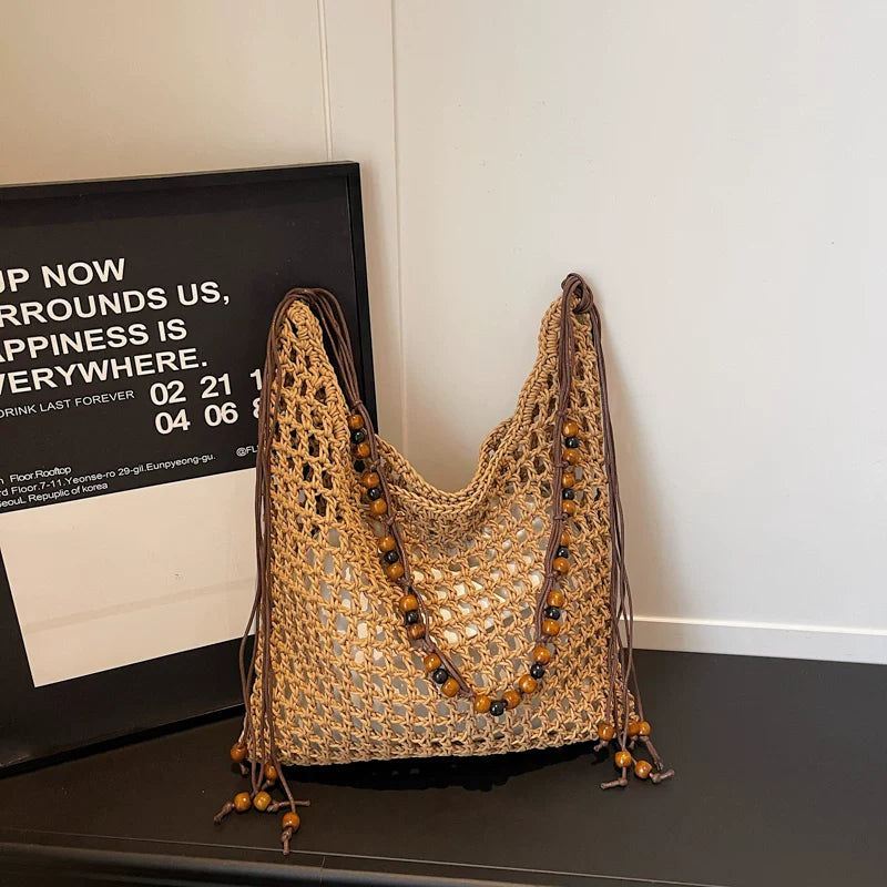 Vacation straw bag side view detail beaded fringe