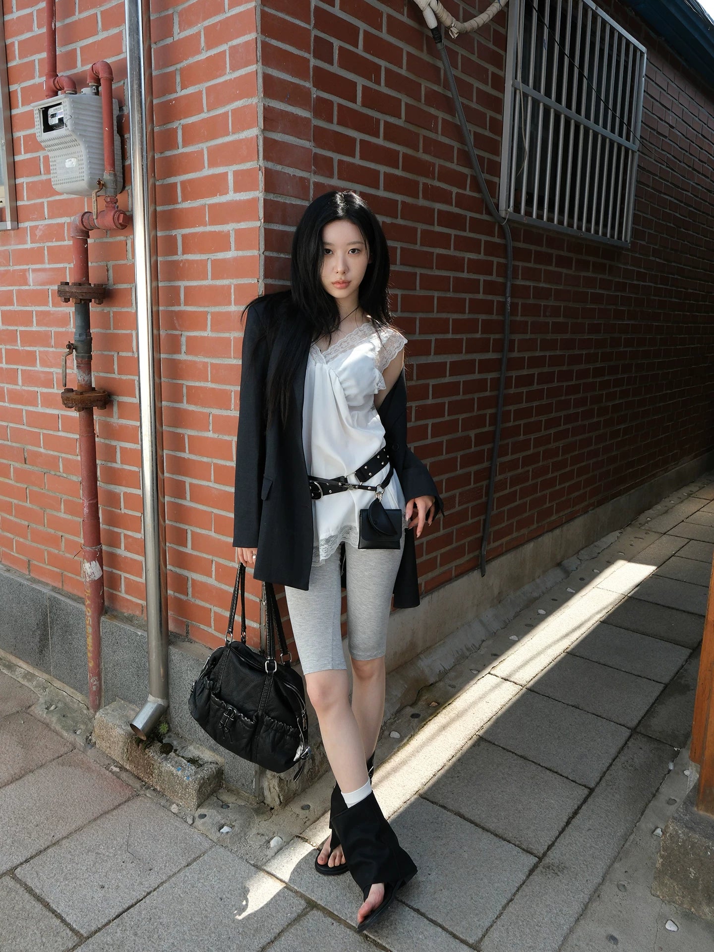 Mooreyu round-toe toe-ring Roman sandal boot black front view